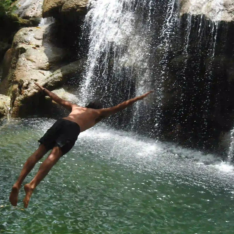 Man jumping in to lagoon
